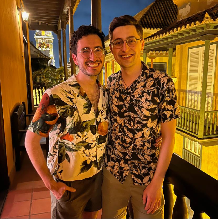 Darius and Tom on a balcony overlooking a street in Cartagena