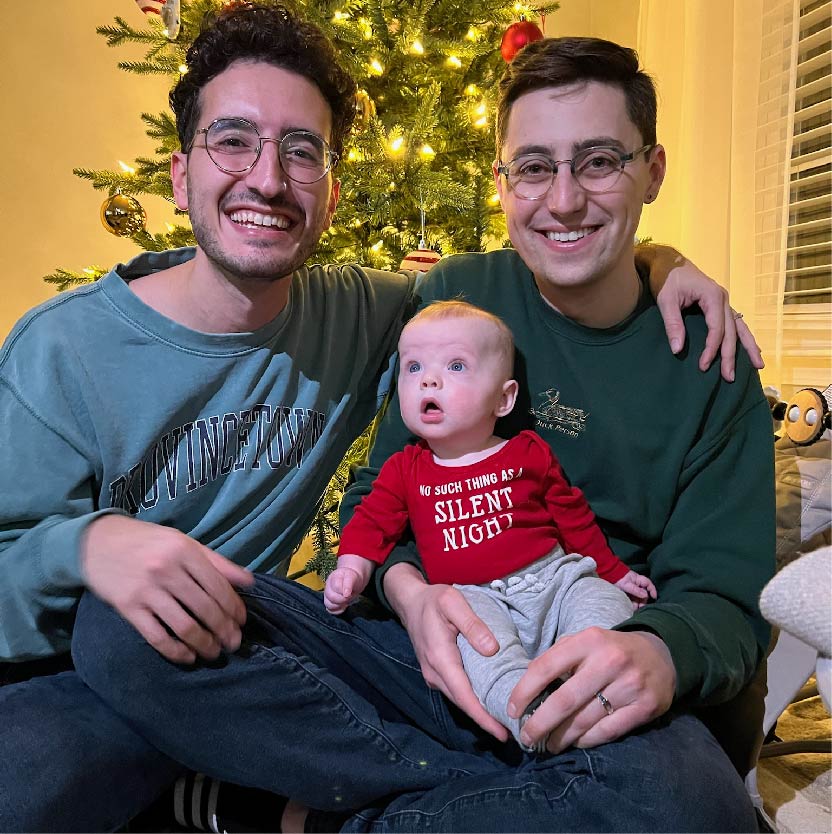 Darius and Tom with their nephew Flynn at Christmas