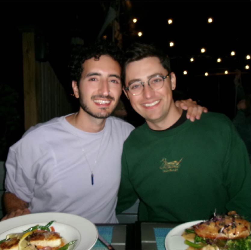 Darius and Tom posing at dinner